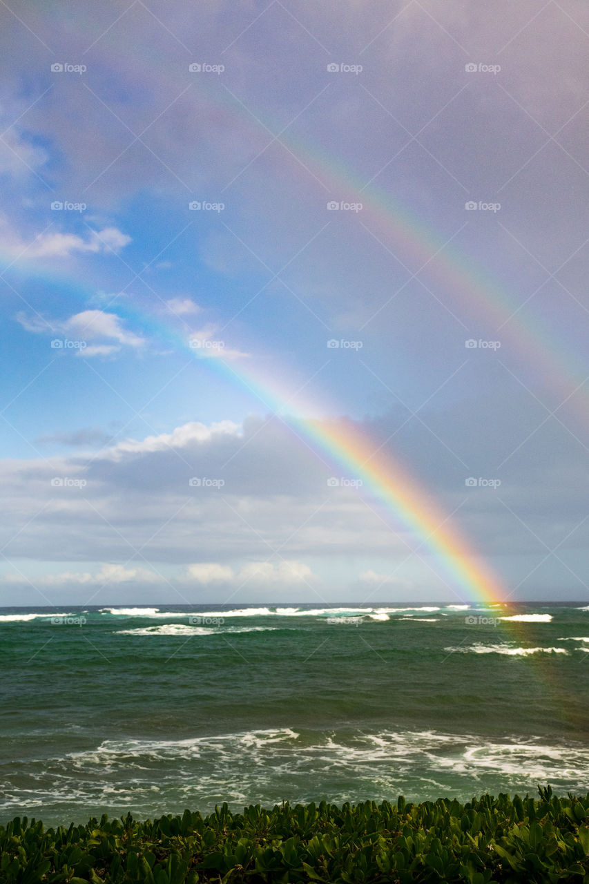 Scenic view of rainbow at sea