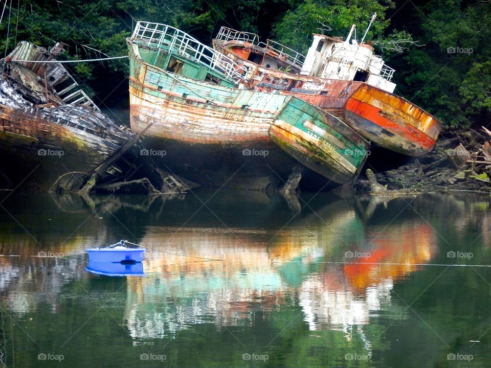 A graveyard with a discarded boat 