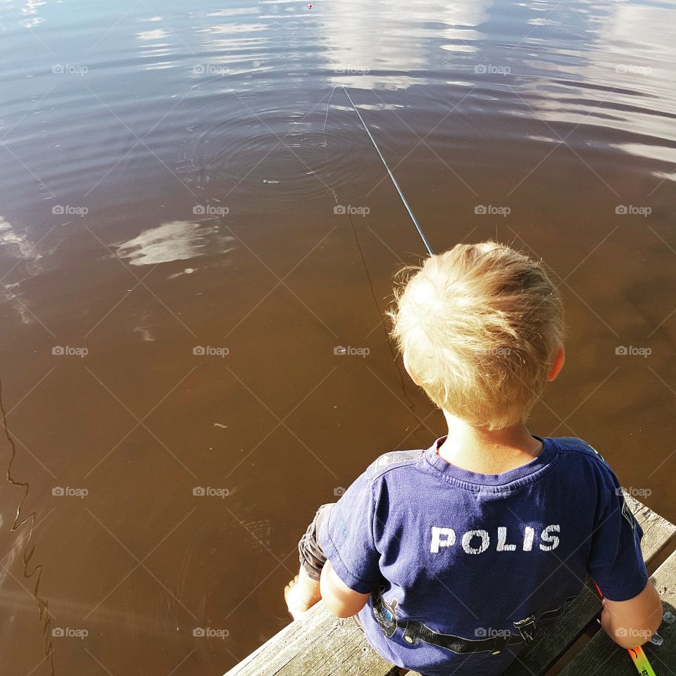 child fishing