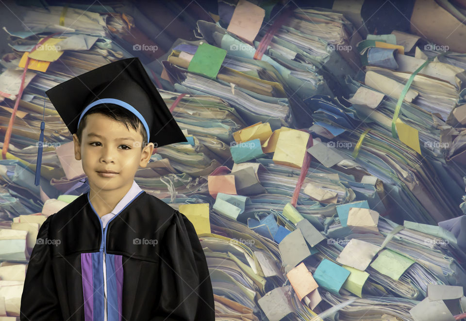 The boy graduated from kindergarten. This study is the first to advance to the next level  Background Colorful Dossier made of paper Stackable lot.