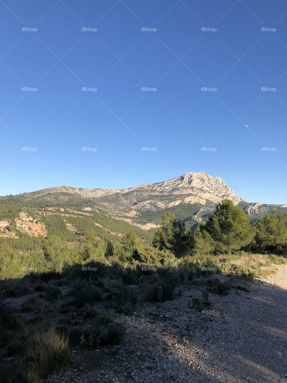 Blue sky behind mountain