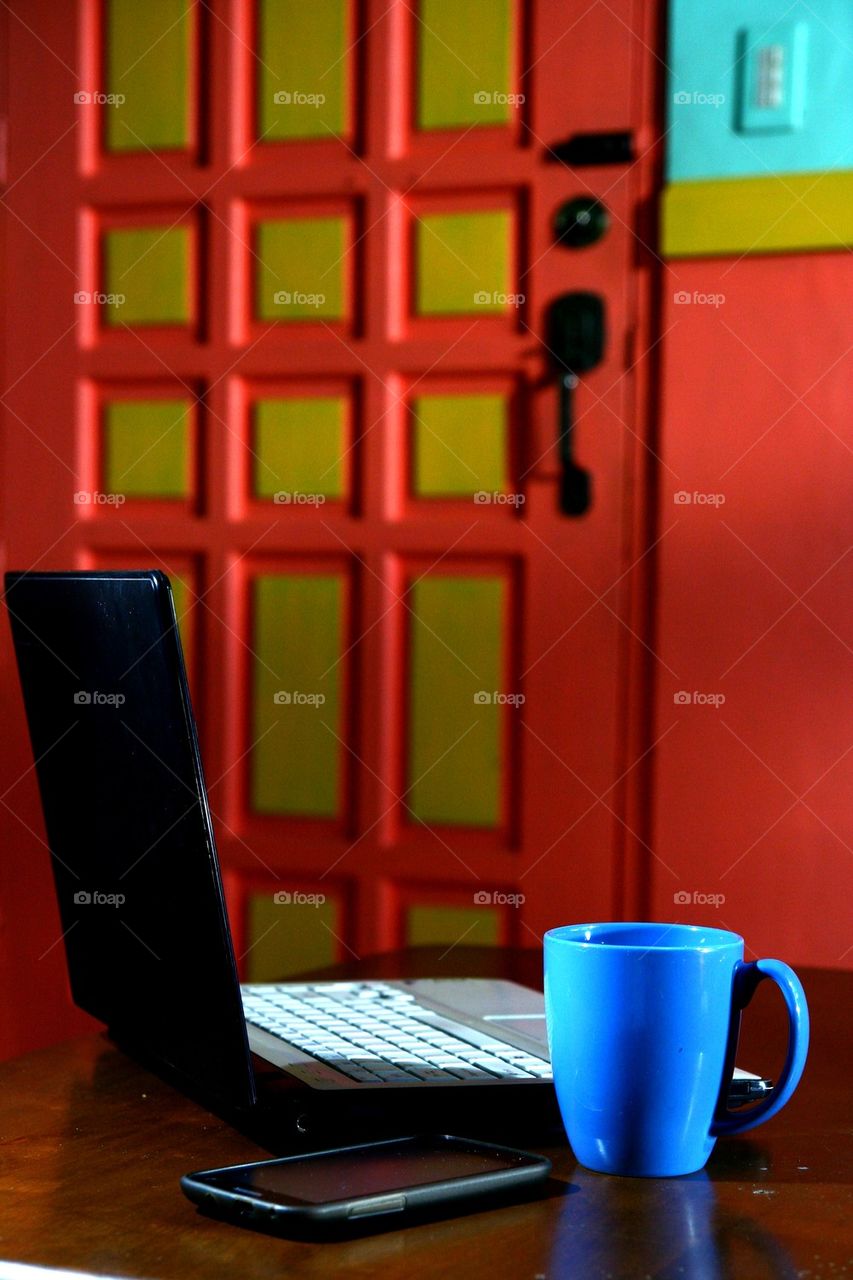 laptop computer, coffee mug and smartphone