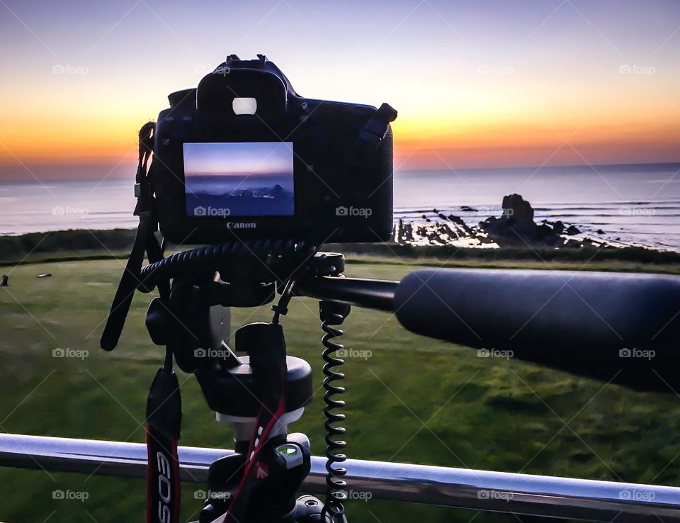 Shooting the Sunset. This was a shot of a sunset shot being taken from the balcony of a luxury holiday home near Widmouth Bay