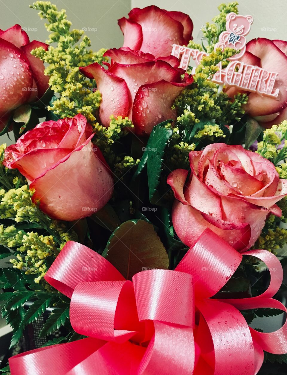 Group of pink glitter covered roses in a bouquet 