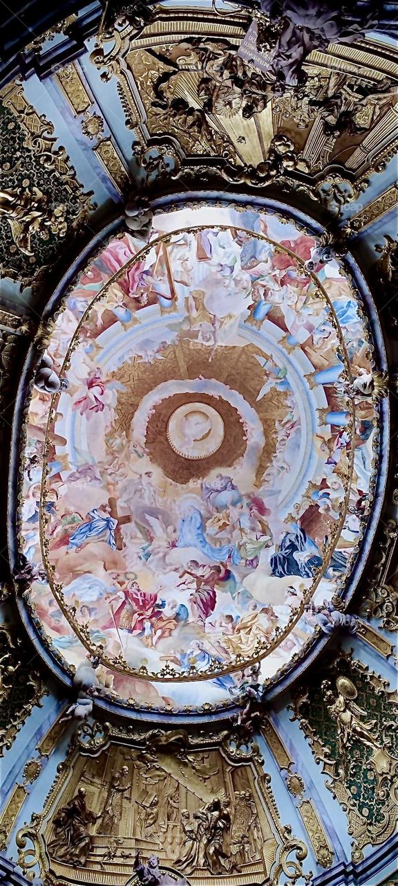 This is the lavishly decorated Baroque style ceiling window of the “Weltenburg Abbey Church” that is dedicated to “St George”. “Weltenburg Abbey” is located directly by the “Danube Gorge” in “Bavaria”, Germany. 2024. Hypnotic Productions