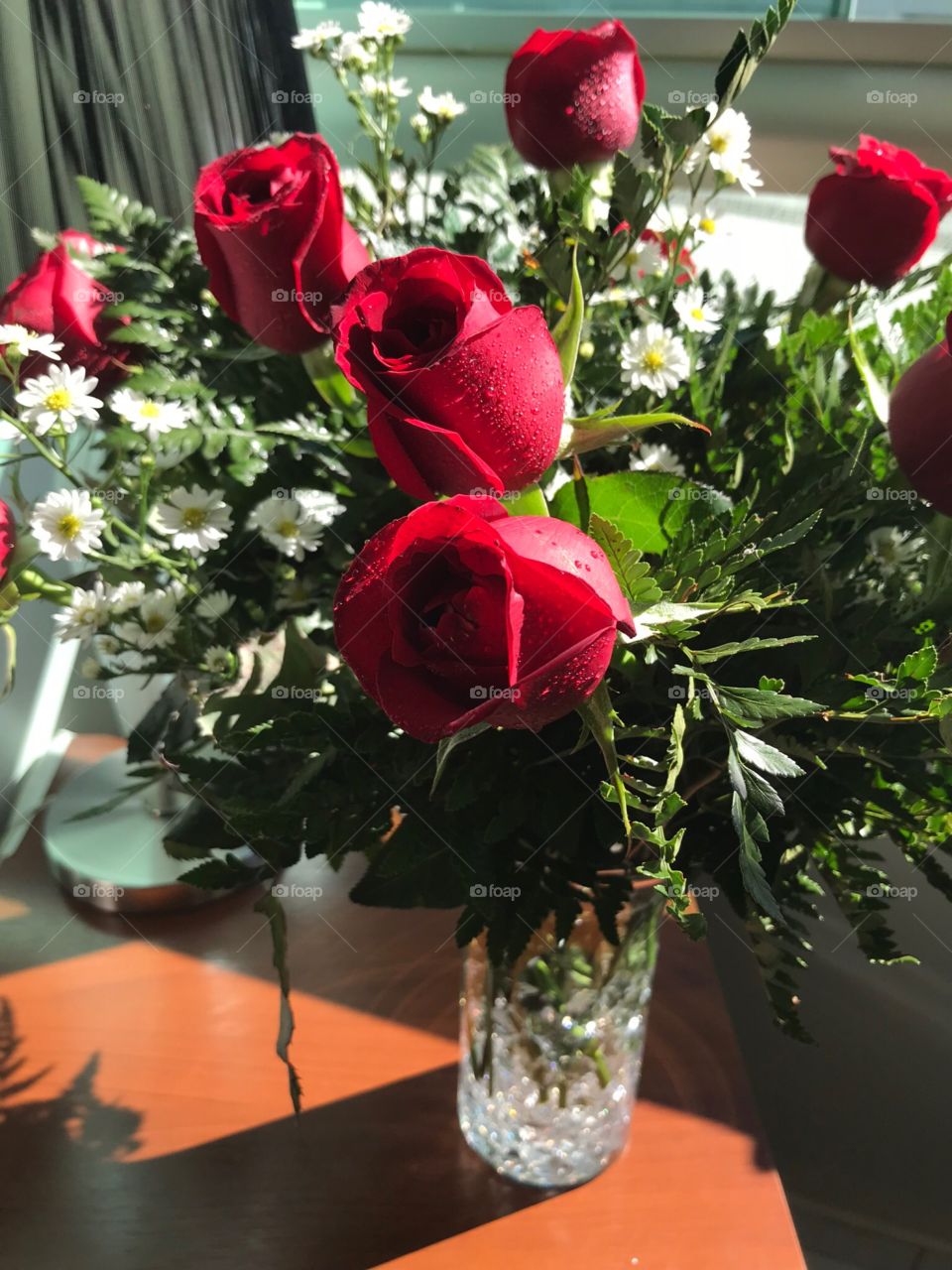 Red roses in crystal vase