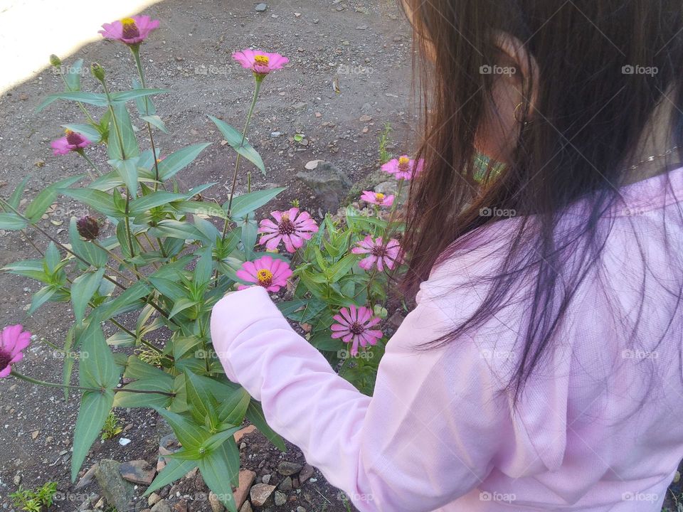 Little girl and flowers