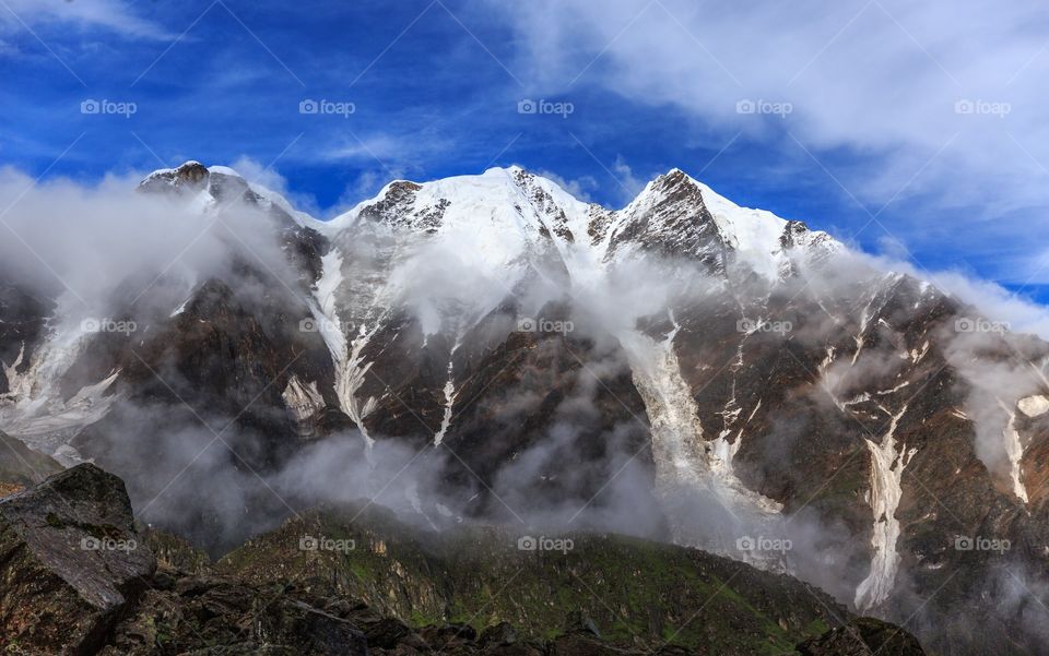 snow capped and foggy , mesmerizing Mandini valley Garhwal, Himachal Pradesh, India