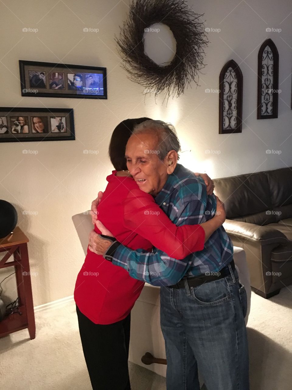 Grandfather hugging granddaughter