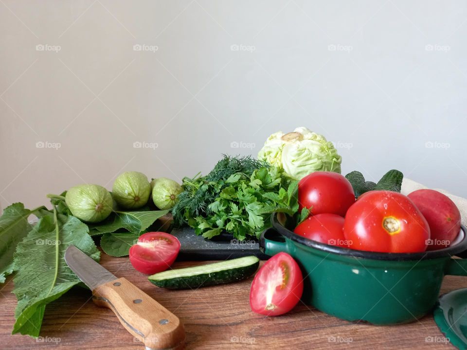 green vegetables and red tomato.