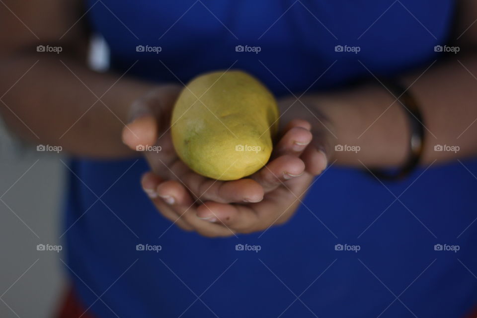 Holding mango 