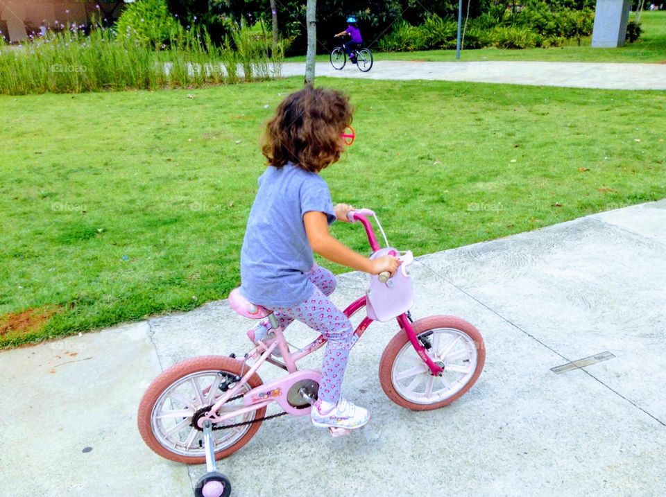 Child riding his bike in the park