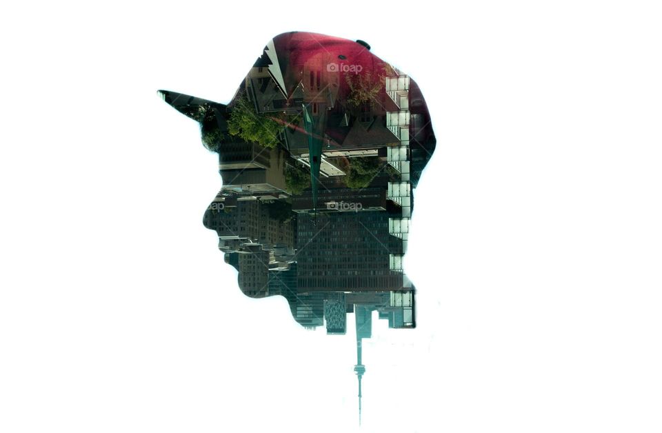 double multi exposure of silhouette outline of head overlay with Toronto skyline and streets