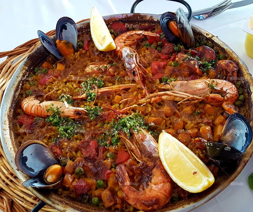Tasty and delicious paella with seafish at Roses, Catalonia