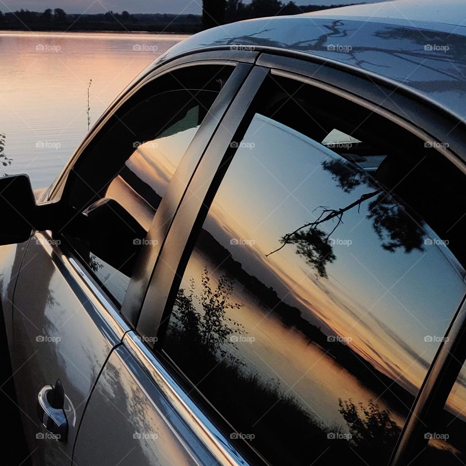 Car decorated with sunset