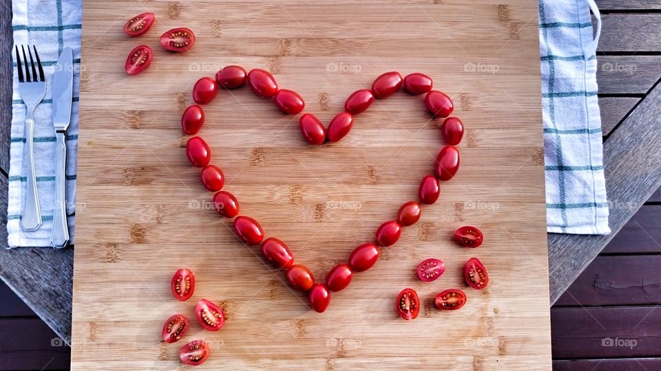 View of heartshape tomatos on table