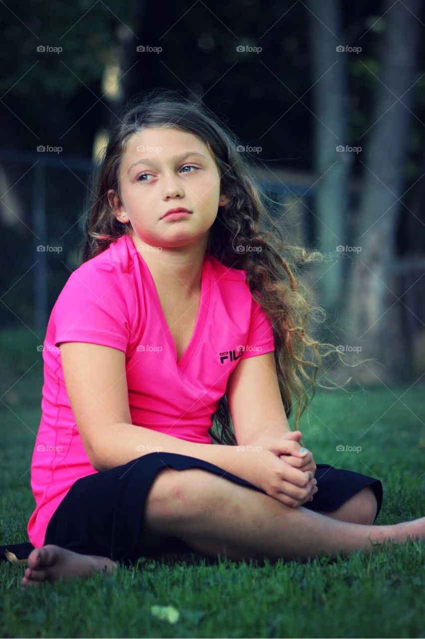 Girl sitting on grass