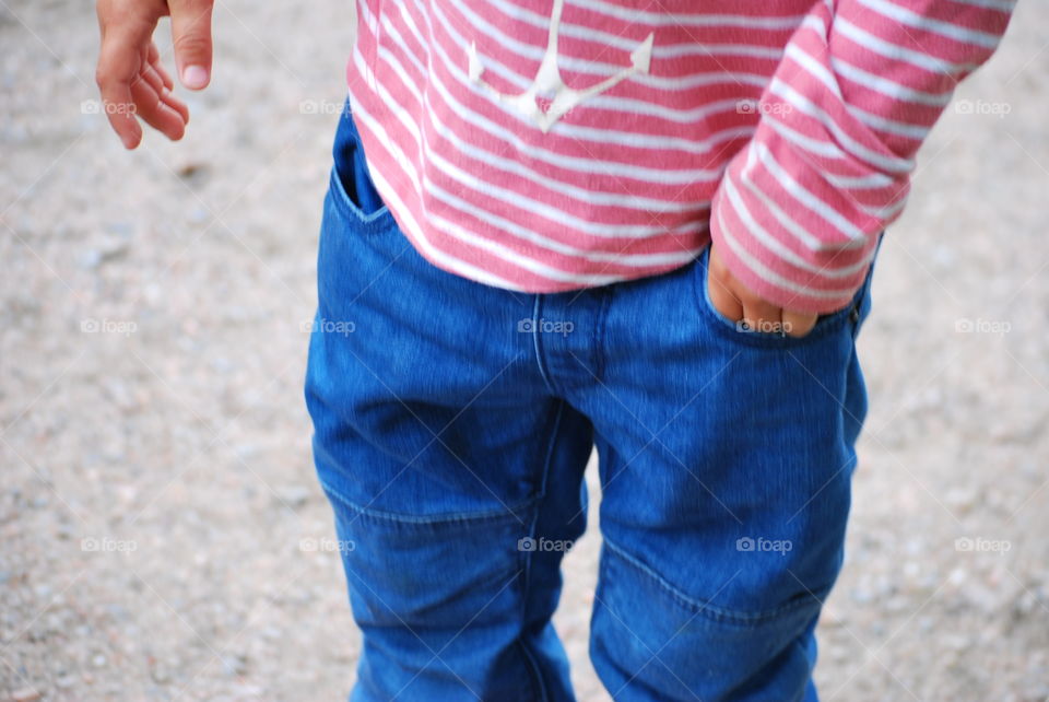 hand in pocket of a child