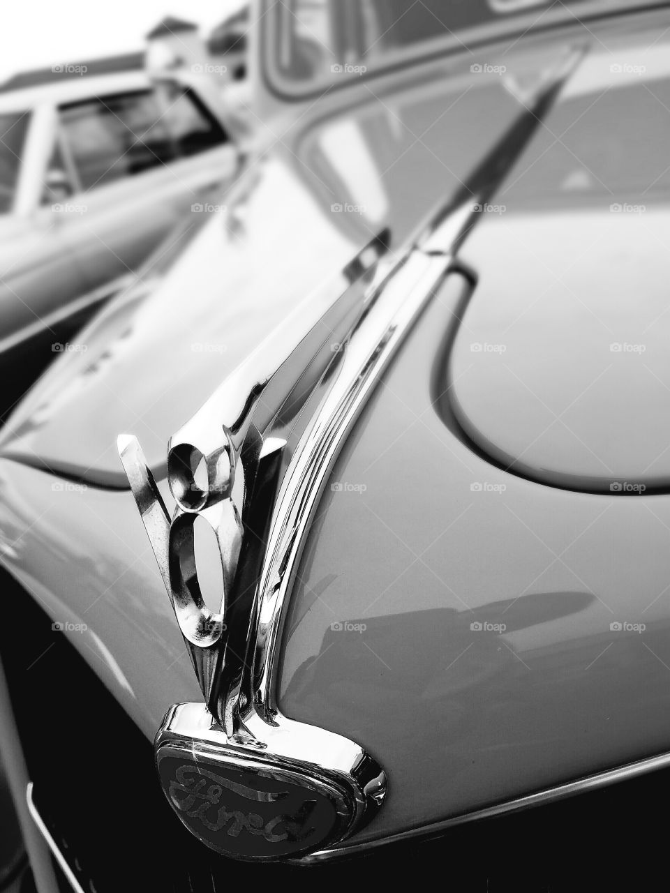 hood ornament Ford closeup black white