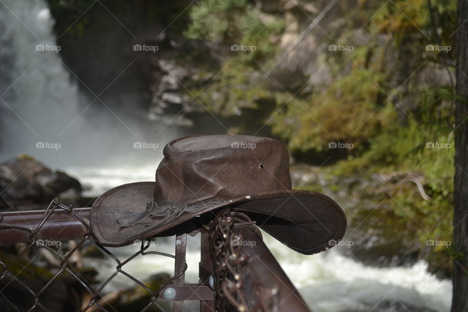 Australian bush hat as prop by waterfall in the Canadian Rocky Mountains in Banff national park