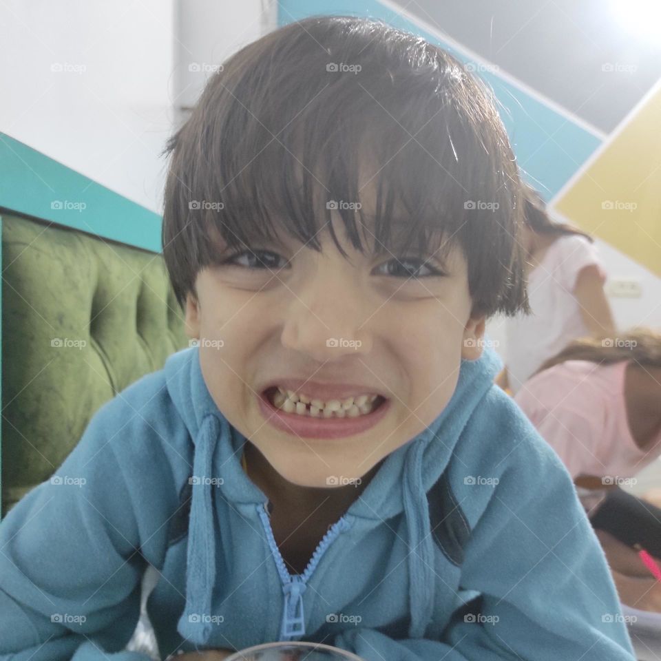 This cute baby after brushing his teeth