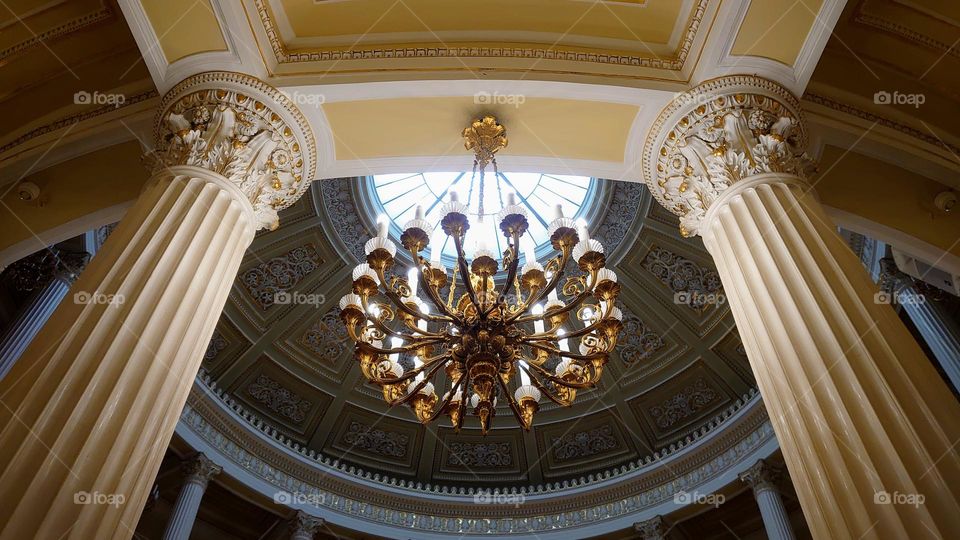 Palace style. Columns. Marble. Chandelier