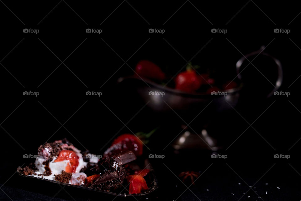 Ice cream with chocolate and strawberries 