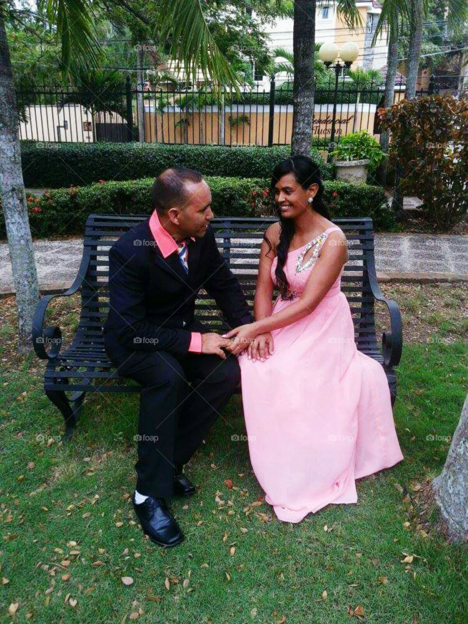Happy couple sitting on bench