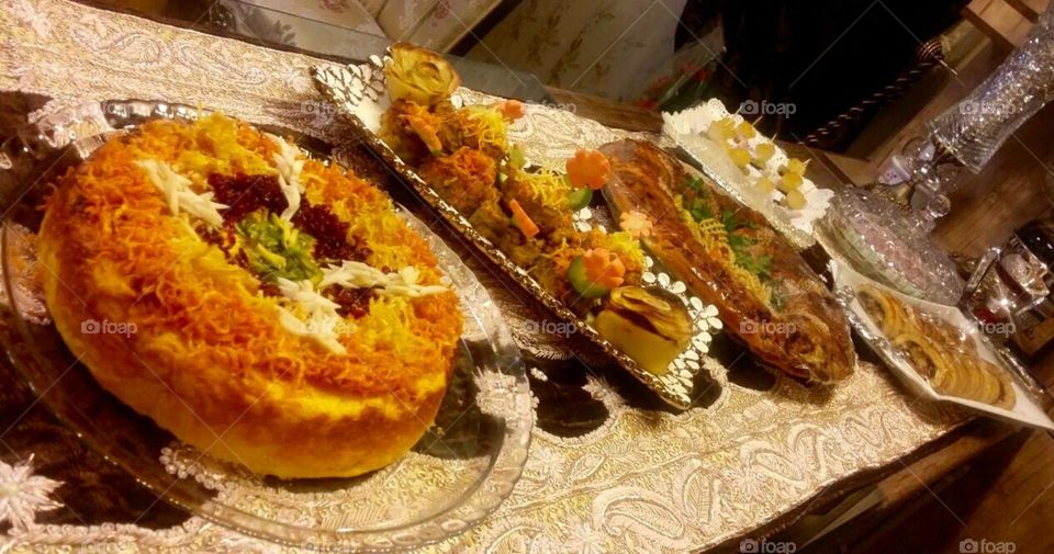 Iranian rice cake made with  rice, yogurt, saffron, egg, and chicken fillets. 
