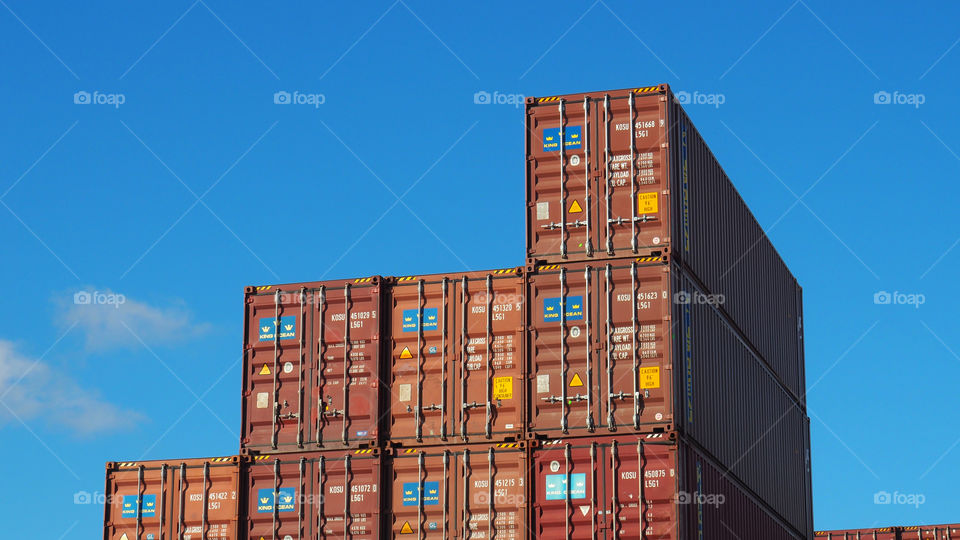 Container cargo ship yard loading exports imports international trade 