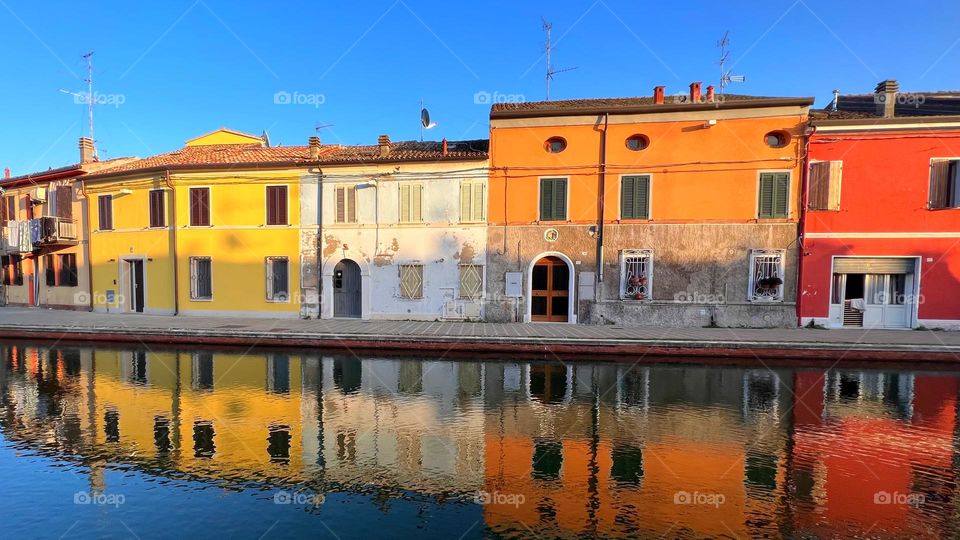 Cityscape reflection on water in a sunny day 