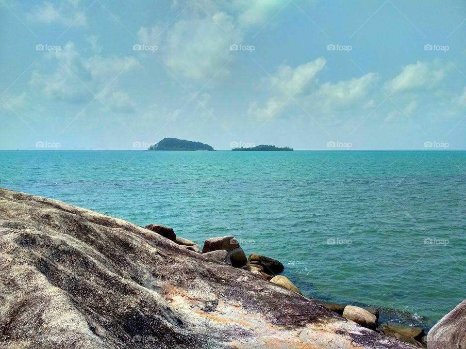 Granite rock island on beach