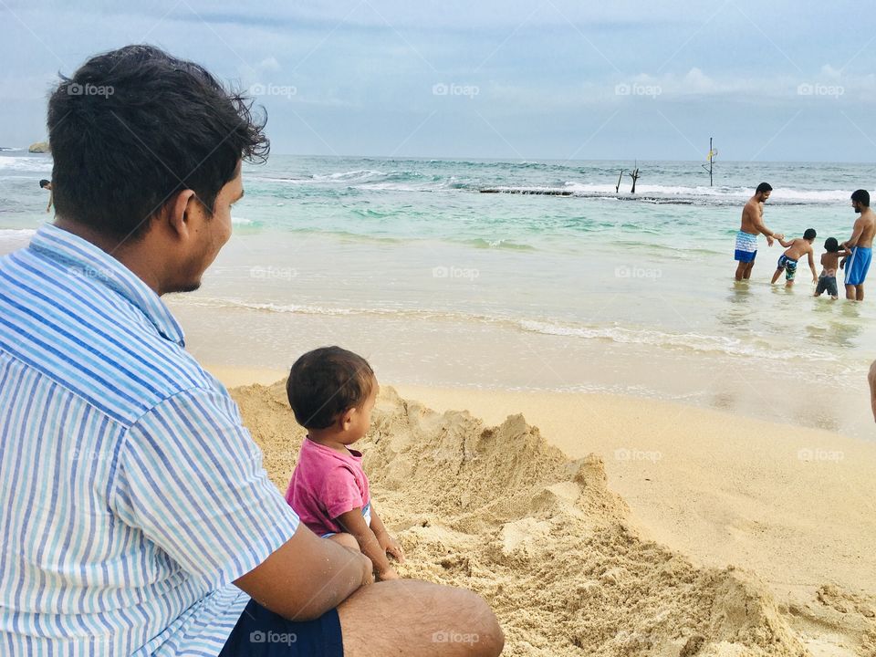 father and son on the beach and see son’s future 