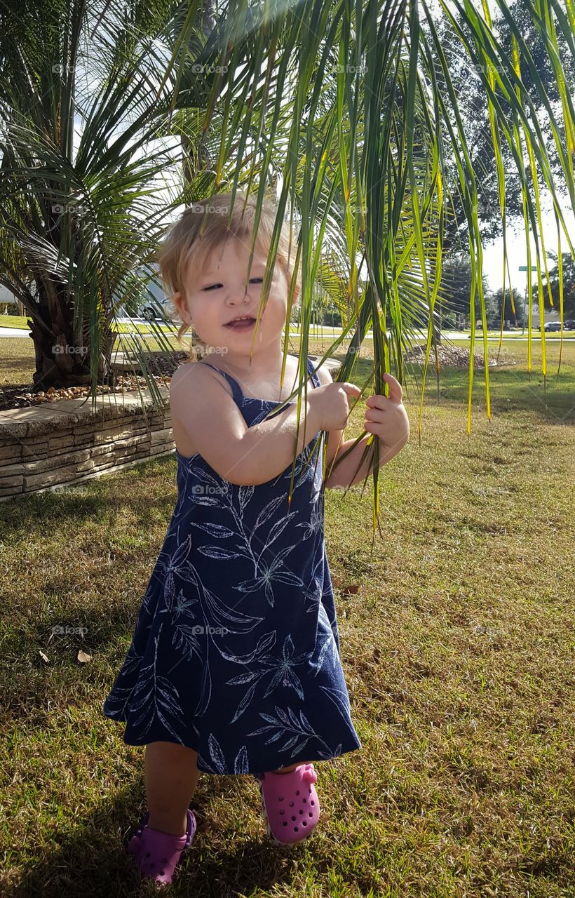 Cute little girl standing in park