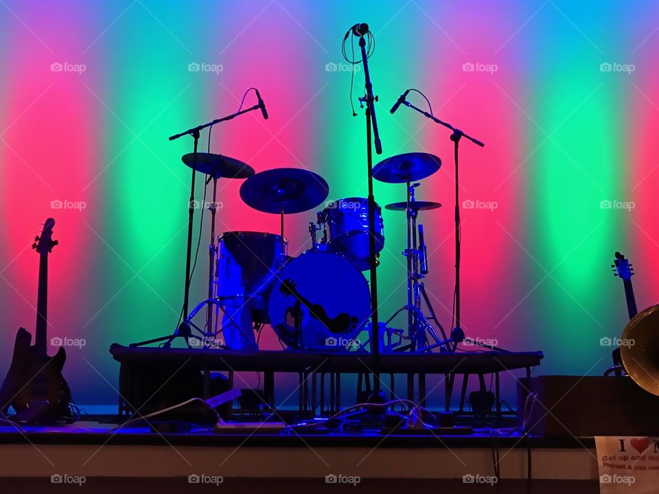 Musical instruments in red and green light.