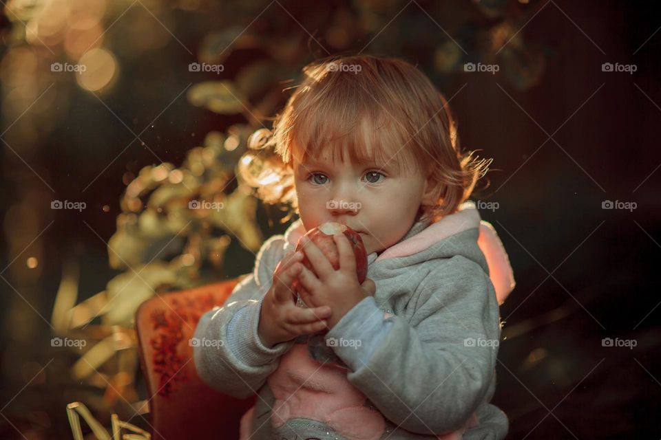 Little girl portrait with apple