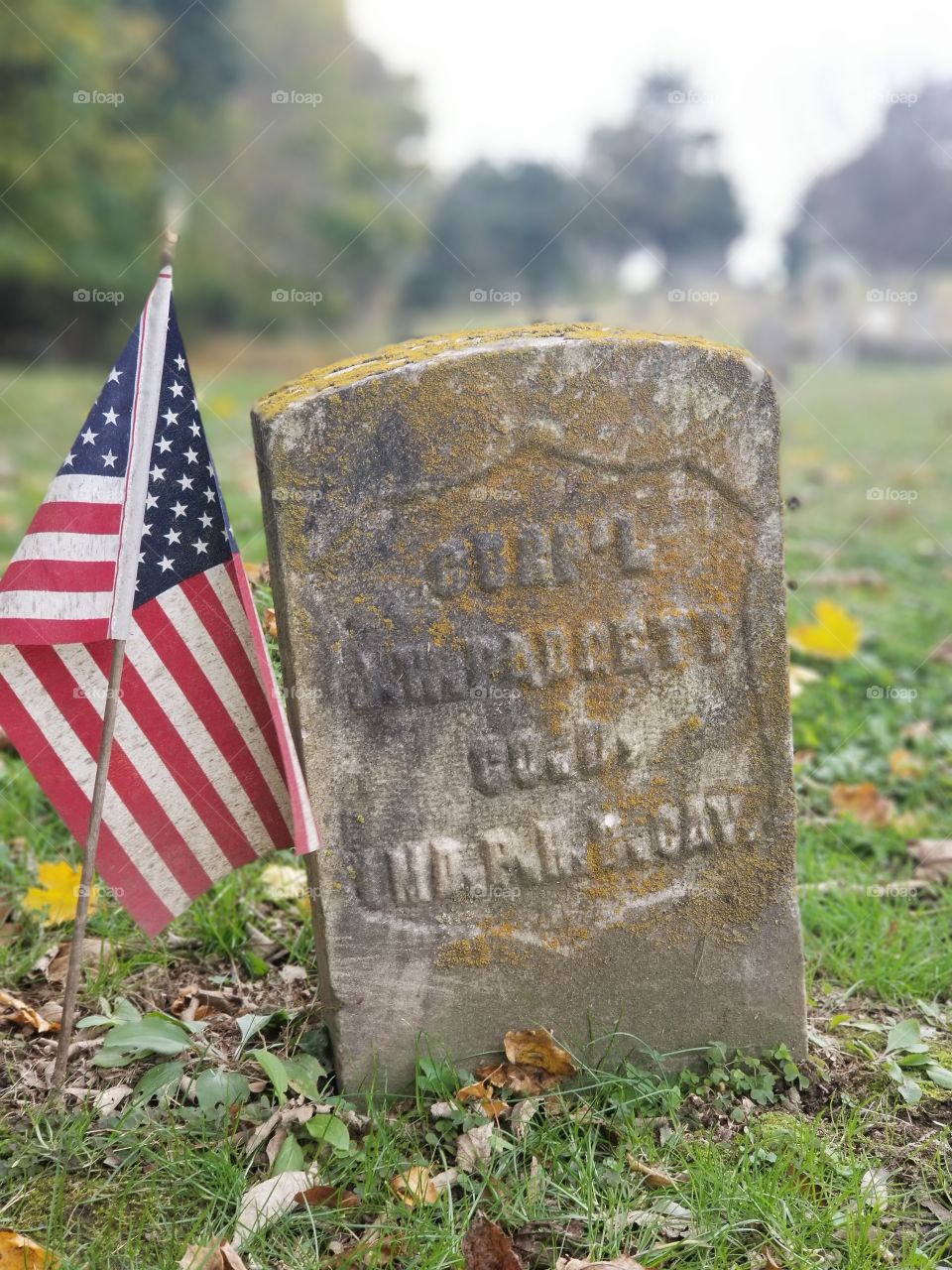 Grave stone with american flag