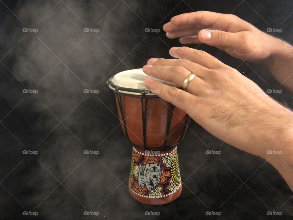 Manly hands on Smoking drum