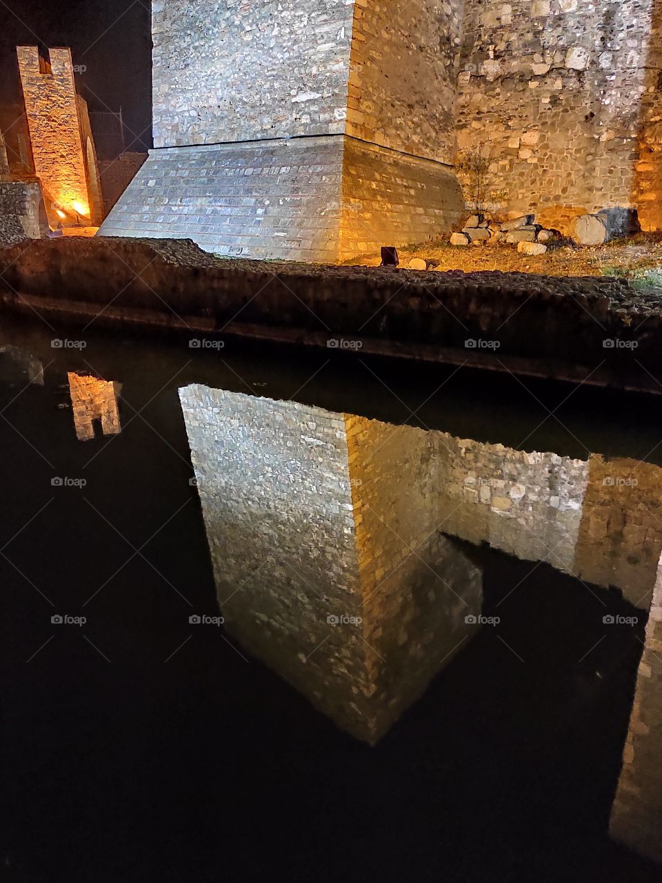 Smederevo Serbia by night fortress tower base reflection in moat