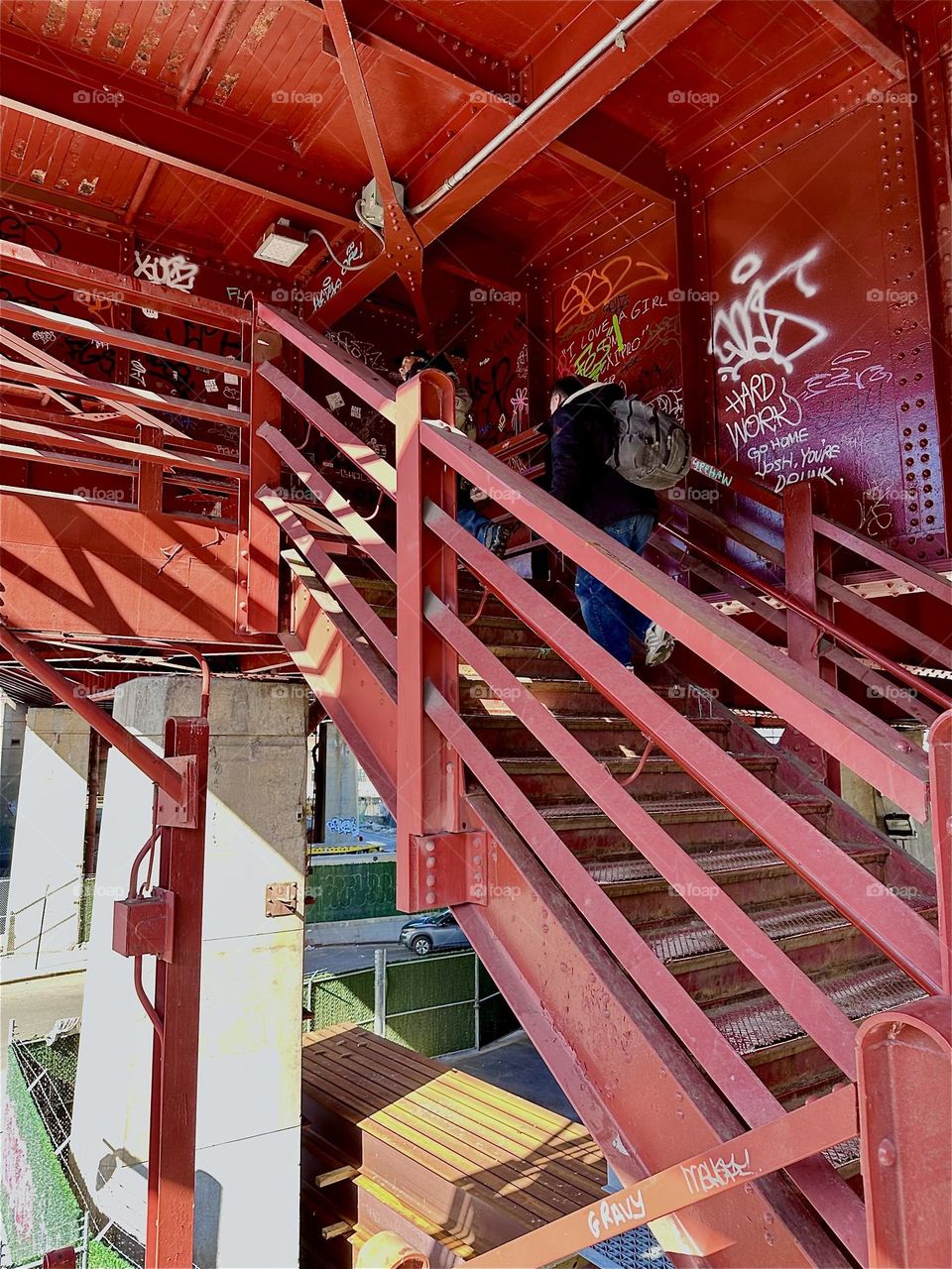 The “Bauhaus” inspired red metal staircase of the “Pulaski Bridge” at “Newtown Creek” in “Greenpoint”, Bklyn comes alive when the sun casts shadows that combine with its geometric shapes creating multifaceted patterns. 2024. Hypnotic Productions