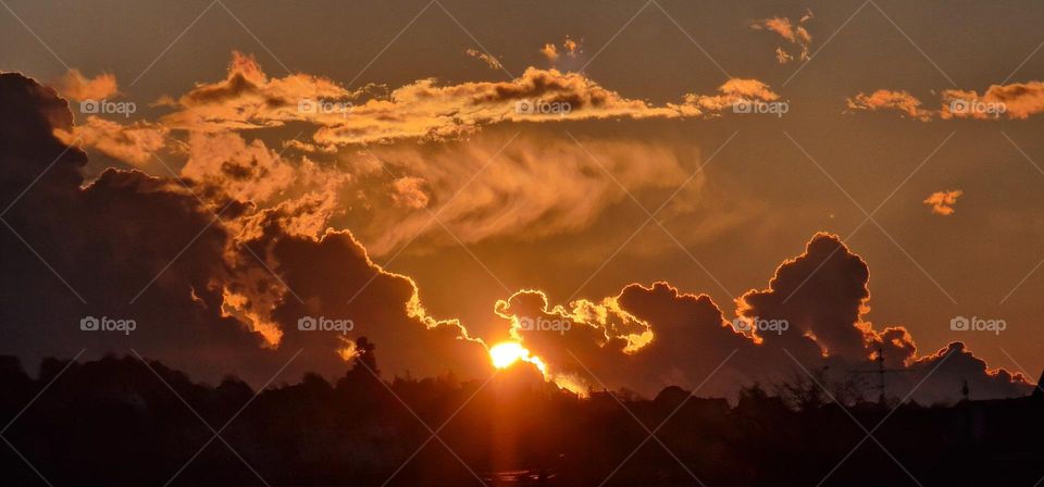 Sunset in the gap of cloudy sky