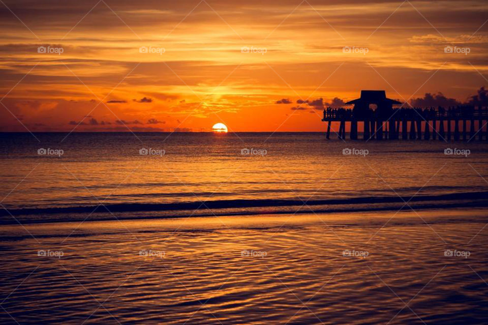 Orange Sunset on the Beach with Pier