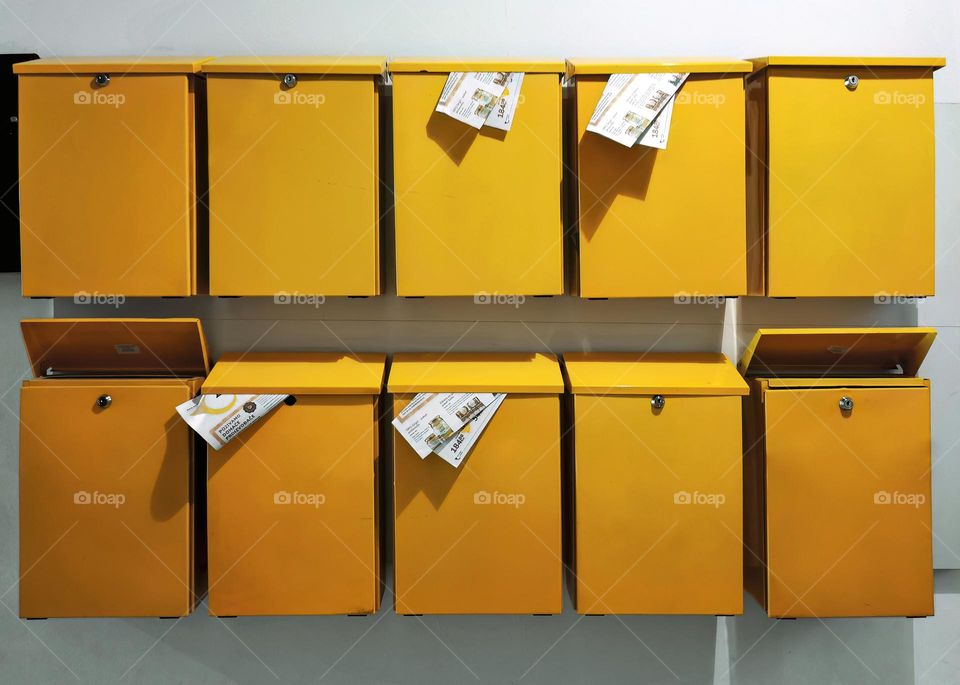 Yellow mailboxes in apartment building