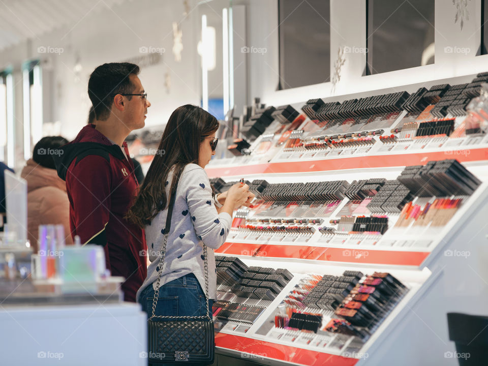 Couple is shopping in the cosmetic store