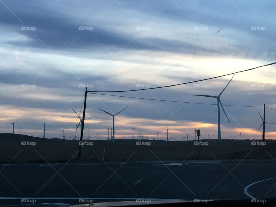 Sunsets and power on hwy 12 off of hwy 113 in California on the backroads. This speaks California living! The giant windmills to produce power to those power lines! 