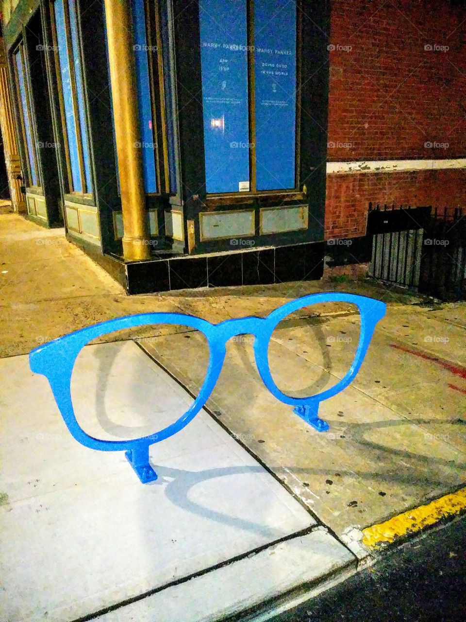 Giant eyeglass frames as a bicycle tie up.
