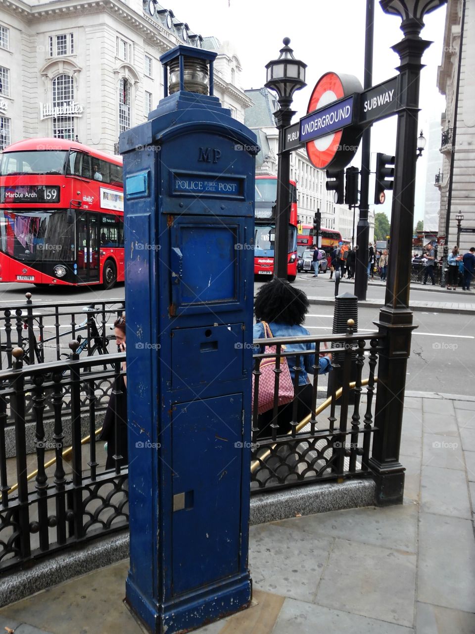 police call box on the corner outside picadilly subway station.