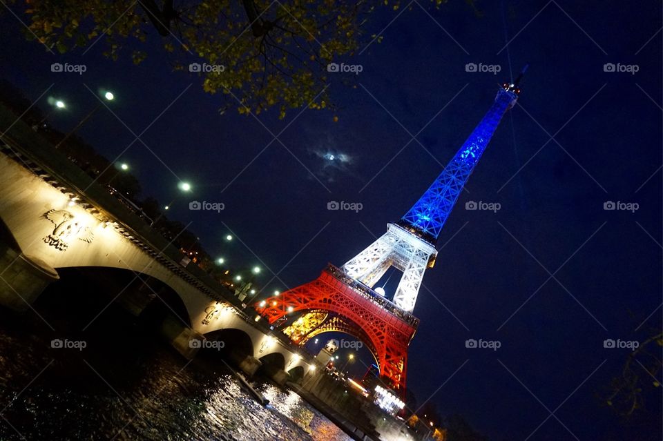 The Eiffel Tower lit up after the Paris attacks, Nov 2015