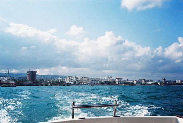 White yacht sea voyage, summer city sea view
