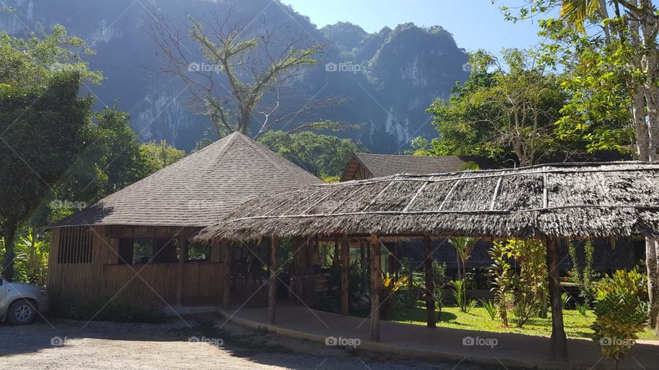 Tropical hut and mountains